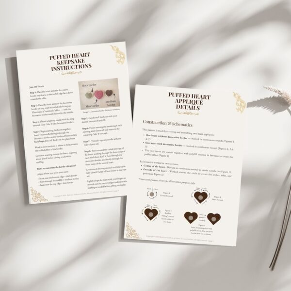 Two printed crochet pattern pages from the Puffed Heart Keepsake PDF, titled ‘Instructions’ and ‘Appliqué Details.’ The pages include diagrams, heart size options, written steps, and schematics. Neutral styling with gold embellishments and soft shadows for a vintage, elegant look.